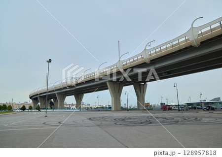 A Modern Elevated Bridge Structure Positioned Distinctively in an Urban Landscape Setting A Modern Elevated Bridge Structure Positioned Distinctively in an Urban Landscape Setting 128957818