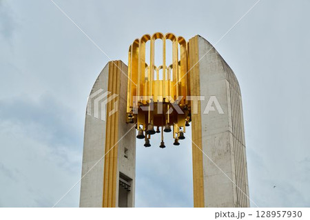 The magnificent Golden Carillon structure beautifully contrasts against the clear blue sky above The magnificent Golden Carillon structure beautifully contrasts against the clear blue sky above 128957930