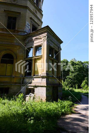 An Abandoned Historical Building Enveloped by Lush, Beautiful Greenery and Natures Embrace An Abandoned Historical Building Enveloped by Lush, Beautiful Greenery and Natures Embrace 128957944
