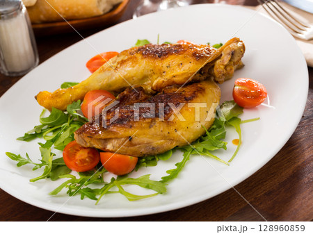 Tasty snack, roasted chicken legs 128960859