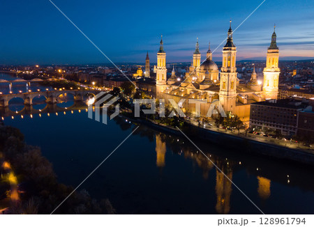 Night aerial view of Zaragoza with Basilica 128961794