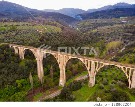 Arched viaduct in picturesque area near Spanish township of Guadalupe 128962204