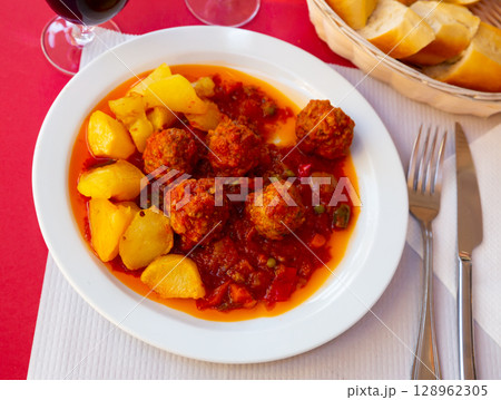 Albondigas, hot stew tomato soup with meatballs 128962305