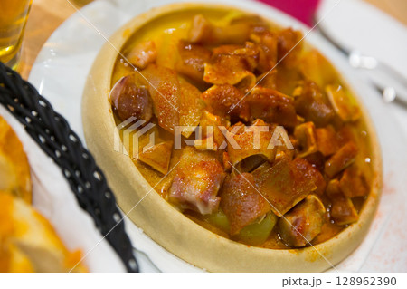 Spanish dish - roasted pig ears Spanish dish - roasted pig ears 128962390