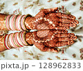 Bridal mehndi - Henna tattoo on women hands.  128962833