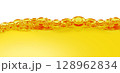 Oil surface and ripple background. orange summer drink with bubbles. oil close up. 128962834