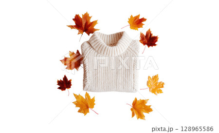 White sweater rests among colorful autumn leaves, created with AI, PNG 128965586