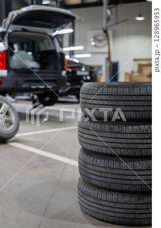 Changing tires for a car according to the season. Changing tires for a car according to the season. 128965953