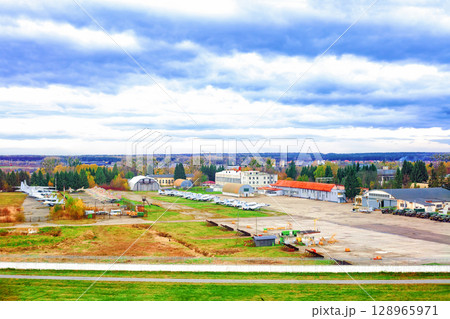 Old military airfield with parked fighter planes and army cars in Lviv, Ukraine 128965971