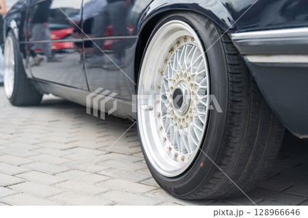 Close-Up of Custom Car Wheel and Tire Excellence. Close-Up of Custom Car Wheel and Tire Excellence. 128966646