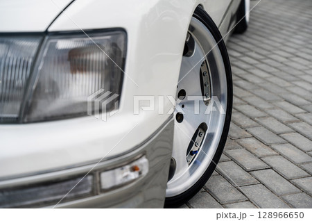 Close-Up of Custom Car Wheel and Tire Excellence. Close-Up of Custom Car Wheel and Tire Excellence. 128966650