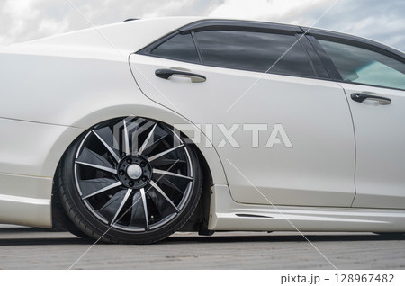 Close-Up of Custom Car Wheel and Tire Excellence. Close-Up of Custom Car Wheel and Tire Excellence. 128967482