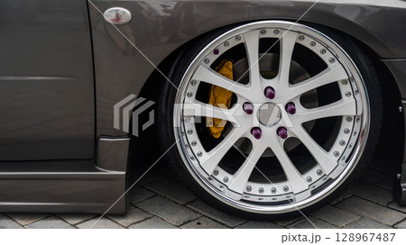 Close-Up of Custom Car Wheel and Tire Excellence. Close-Up of Custom Car Wheel and Tire Excellence. 128967487