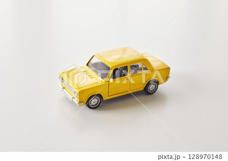 Yellow Toy Car on Clean White Background Yellow Toy Car on Clean White Background 128970148