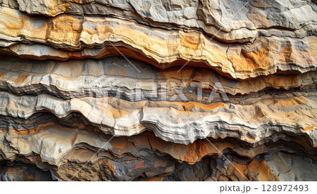 Detailed View of Stratified Rock Formation with Brown Gray and Orange Layers Detailed View of Stratified Rock Formation with Brown Gray and Orange Layers 128972493