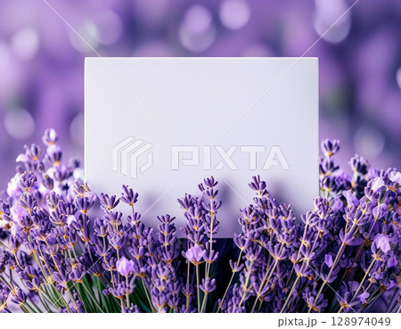Delicate lavender flowers bloom vibrantly, framing a blank card waiting for heartfelt messages or creative ideas. The soft colors evoke a dreamy, tranquil atmosphere Generative AI 128974049