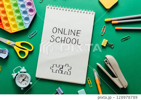 A notebook with the words Online School written on it 128978789