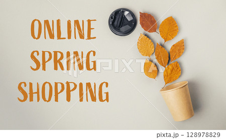 A coffee cup with leaves on it is on a white background 128978829