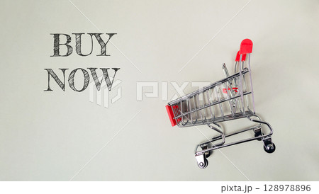 Shopping cart with the words buy now written on it Shopping cart with the words buy now written on it 128978896