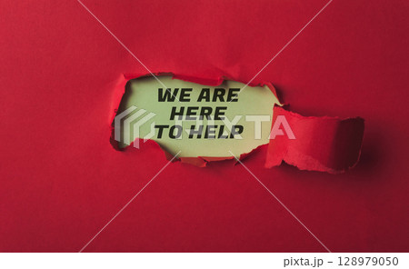 A red background with a torn piece of paper that says We are here to help A red background with a torn piece of paper that says We are here to help 128979050