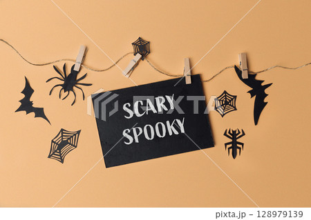 Black sign with the word scary written on it Black sign with the word scary written on it 128979139