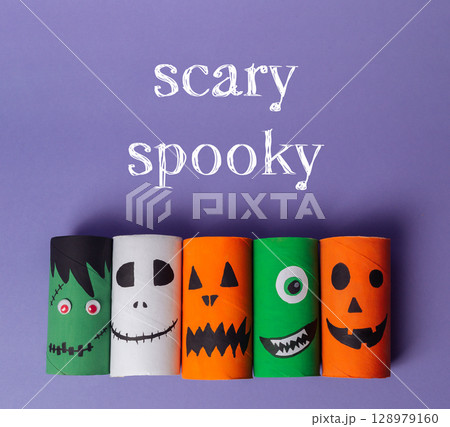 Group of paper tubes with scary faces on them Group of paper tubes with scary faces on them 128979160