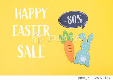 Yellow background with a carrot and a rabbit on it Yellow background with a carrot and a rabbit on it 128979185