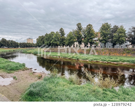 River with a wall on the side of it River with a wall on the side of it 128979242
