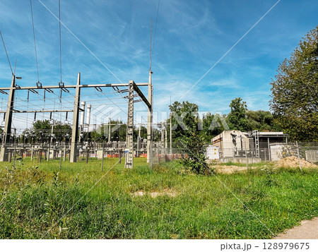 Large power station with a fence around it 128979675