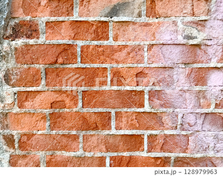 A brick wall with a white line in the middle A brick wall with a white line in the middle 128979963