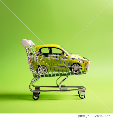 Toy car is sitting on a shopping cart Toy car is sitting on a shopping cart 128980227