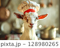 Goat wearing a chef's hat and standing in front of a kitchen 128980265