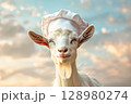 Goat wearing a chef's hat and smiling 128980274