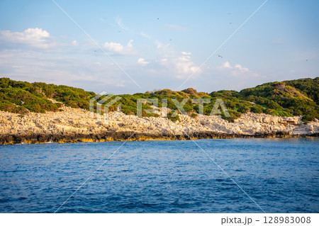 Uninhabited islands of the Lastovo National Park surrounded by calm sea in Croatia. Nature reserve, remote landscape and Mediterranean summer escape 128983008