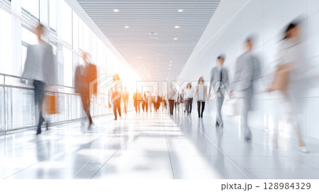 Office workers walking modern corporate building hallway during morning rush light reflection creates bright urban workplace environment daily Office workers walking modern corporate building hallway during morning rush light reflection creates bright urban workplace environment daily 128984329
