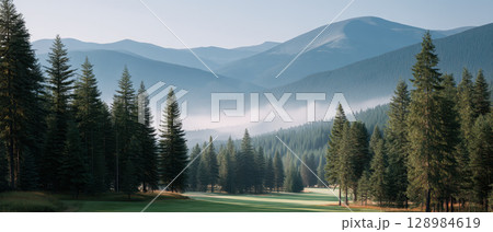 Mountain golf course with tall pine tree forest and misty blue hills in background creating peaceful and scenic outdoor landscape for golf lovers to enjoy nature and sport Mountain golf course with tall pine tree forest and misty blue hills in background creating peaceful and scenic outdoor landscape for golf lovers to enjoy nature and sport 128984619