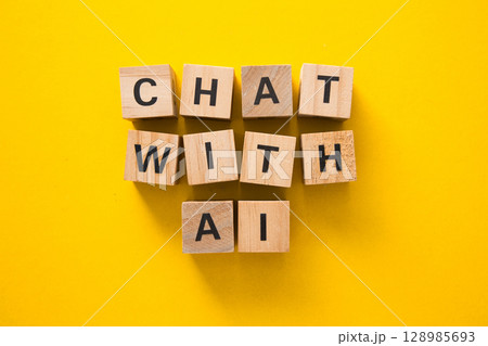 Wooden cubes showing chat with ai on yellow background 128985693