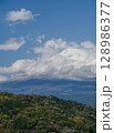 landscape captures the peaceful coexistence of urban life and nature in rural Japan. In the distance, the iconic Mount Fuji rises majestically, Japan 128986377