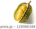 Ripe durian fruit or Durio zibethinus with yellow creamy pulp exposed, isolated on white background. Known as the king of fruits in Southeast Asia. Popular in Thailand, Malaysia, and Indonesia. 128986388