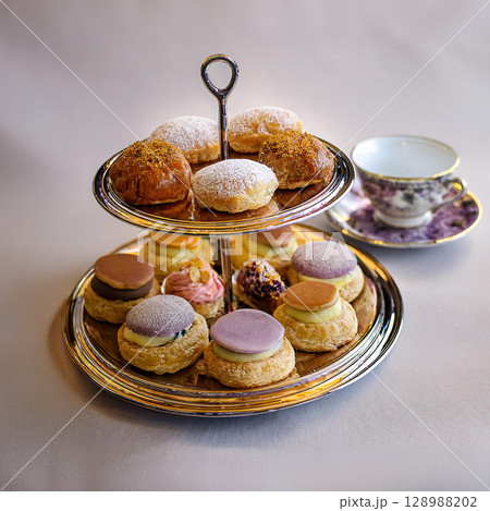 Elegant Pastries and Tea Time Delight 128988202