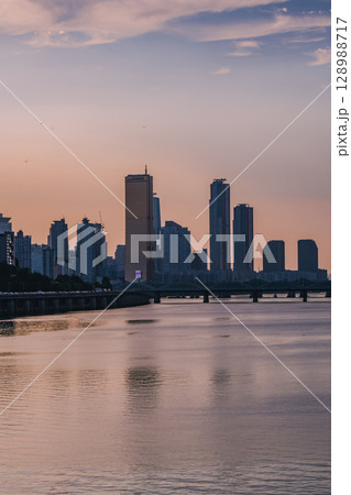 Yeouido, the financial district of Seoul, Korea, and the surrounding city scenery taken during the summer sunset Yeouido, the financial district of Seoul, Korea, and the surrounding city scenery taken during the summer sunset 128988717