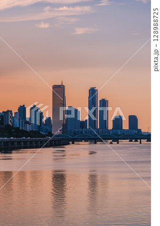 Yeouido, the financial district of Seoul, Korea, and the surrounding city scenery taken during the summer sunset Yeouido, the financial district of Seoul, Korea, and the surrounding city scenery taken during the summer sunset 128988725