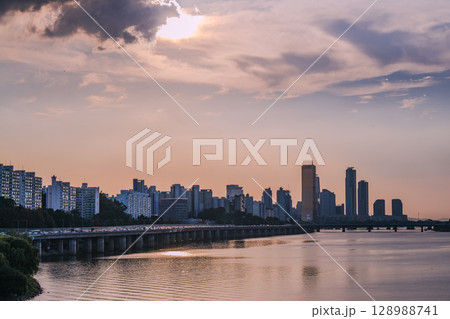 Yeouido, the financial district of Seoul, Korea, and the surrounding city scenery taken during the summer sunset Yeouido, the financial district of Seoul, Korea, and the surrounding city scenery taken during the summer sunset 128988741