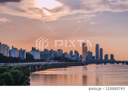 Yeouido, the financial district of Seoul, Korea, and the surrounding city scenery taken during the summer sunset Yeouido, the financial district of Seoul, Korea, and the surrounding city scenery taken during the summer sunset 128988743