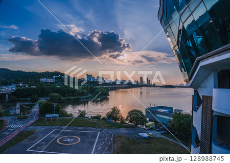 Yeouido, the financial district of Seoul, Korea, and the surrounding city scenery taken during the summer sunset Yeouido, the financial district of Seoul, Korea, and the surrounding city scenery taken during the summer sunset 128988745