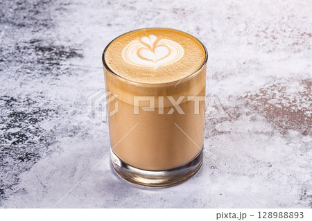 Hot cappuccino beverage in the glass 128988893