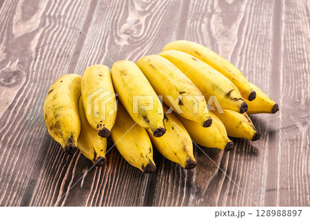 Mini yellow banana fruit heap 128988897