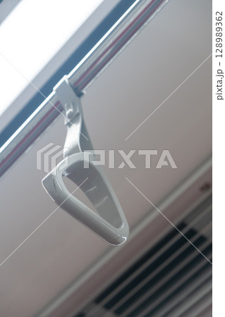Hand grip inside the train of SRT Dark Red Line. It is a rapid transit line operated as part of the MBTA subway system from Bangkok to Rangsit 128989362