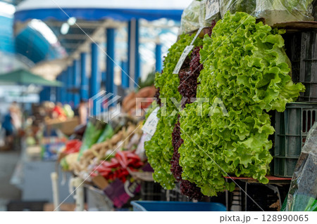 Fresh green leaf lettuce on a stall at a local market. 128990065