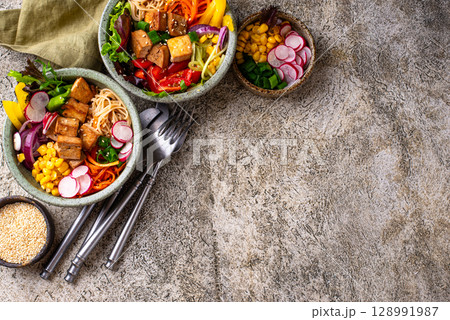 Vegan healthy poke bowl with tofu 128991987